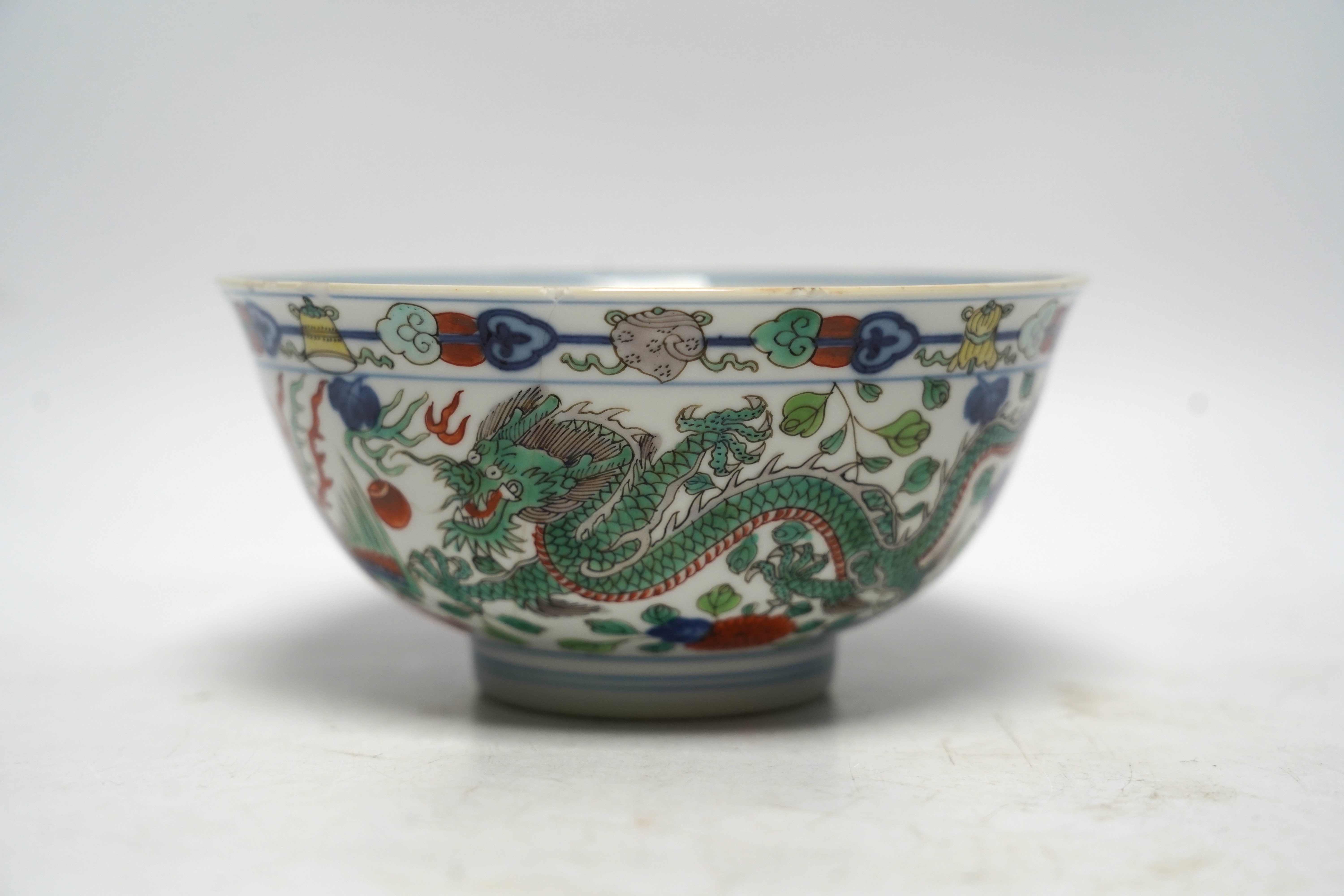 A Chinese wucai ‘dragon and phoenix’ bowl, early 20th century, diameter 15cm